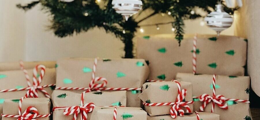 bundle of gifts near Christmas tree